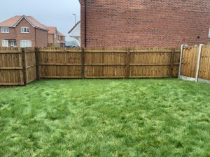 Garden before composite decking and oak sleeper planter were installed