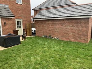 Garden before composite decking and oak sleeper planter were installed