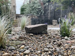 Low-maintenance Mediterranean-style garden with artificial plants