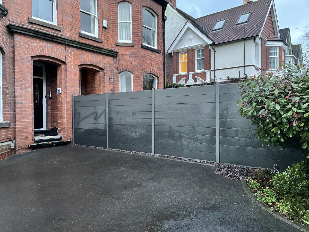 New composite fence panels with aluminium posts by the driveway