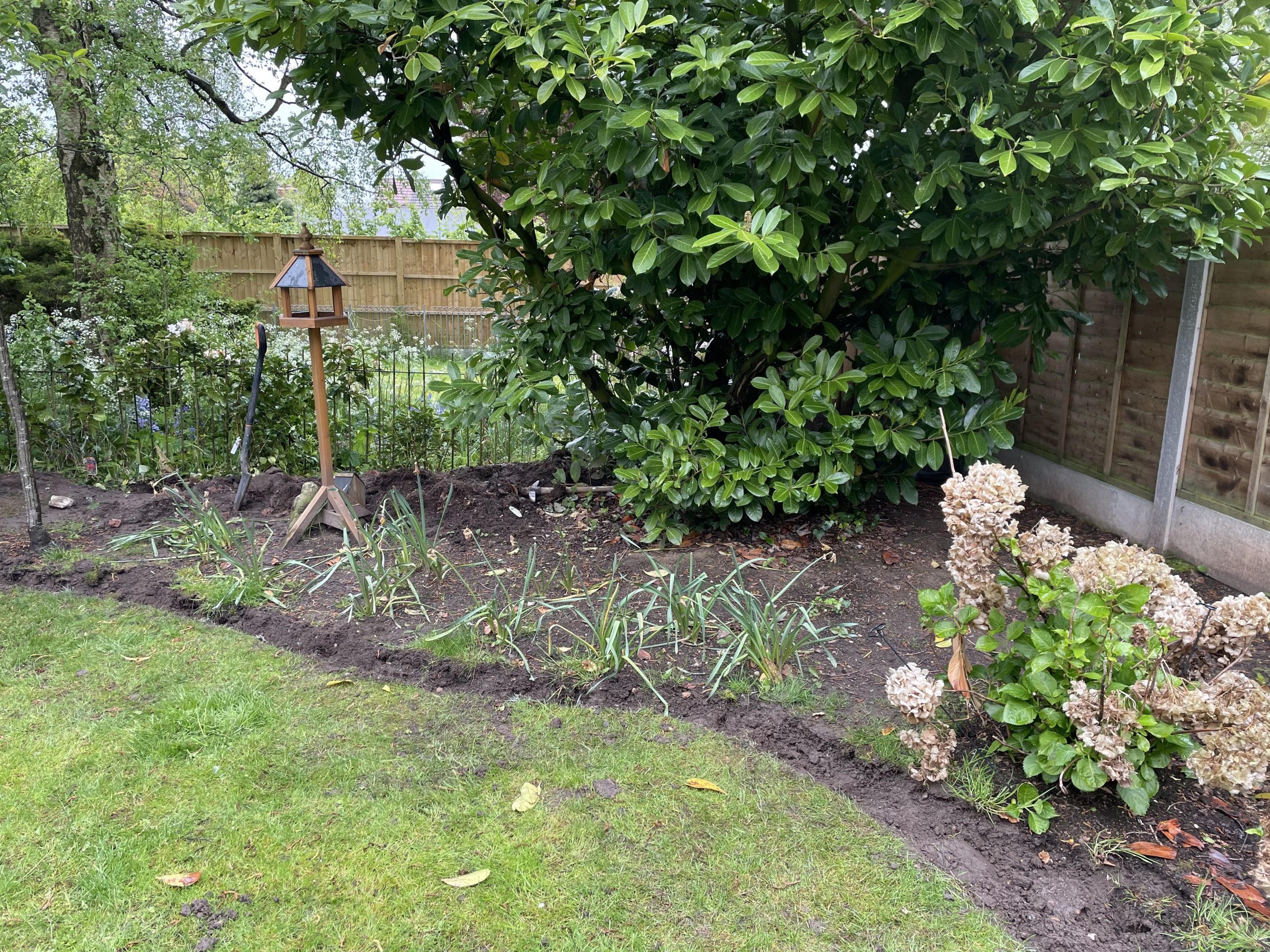Groundwork under way for a slate patio, Stone garden
