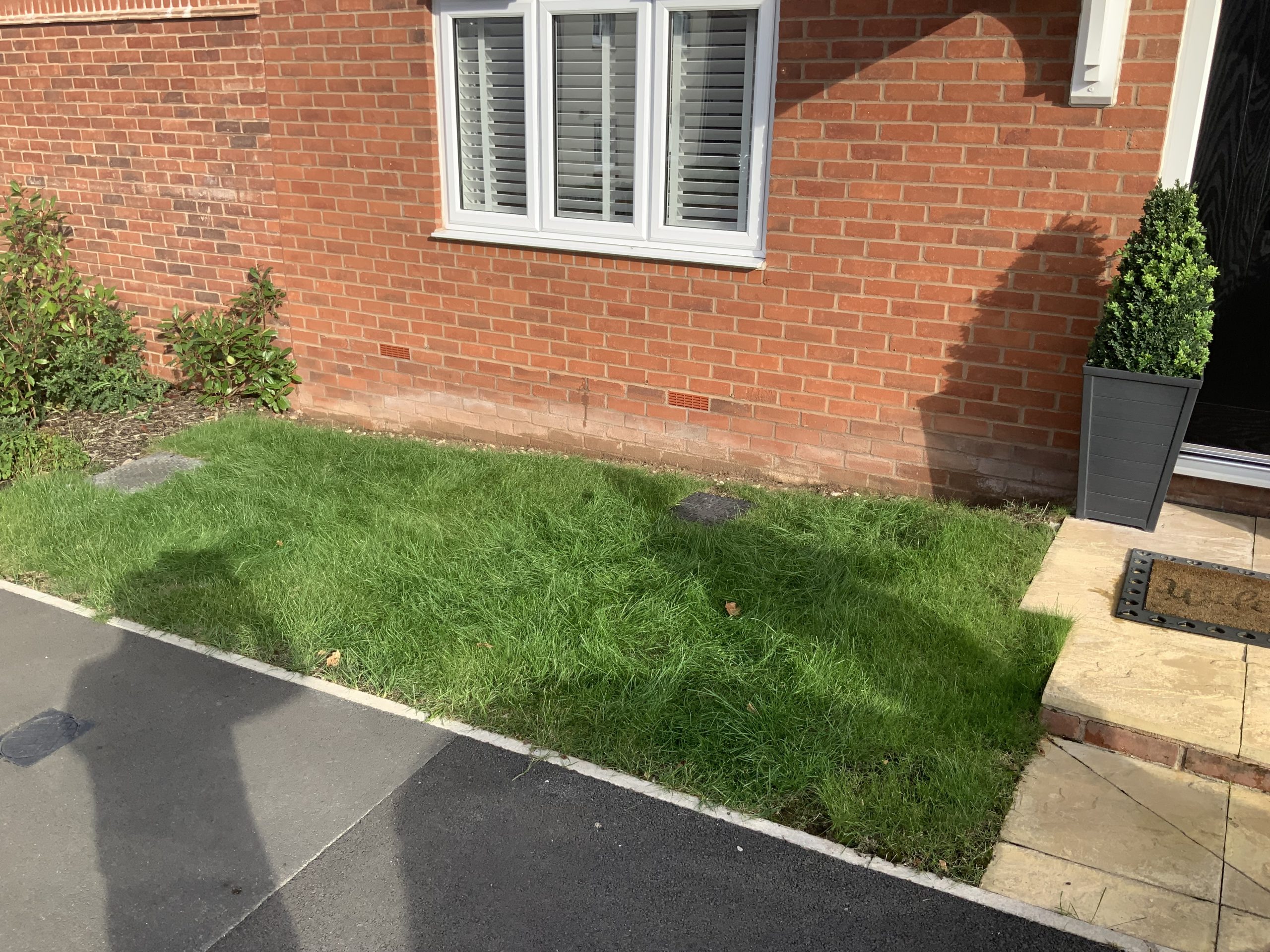 Front door step in Stone before new sleeper borders