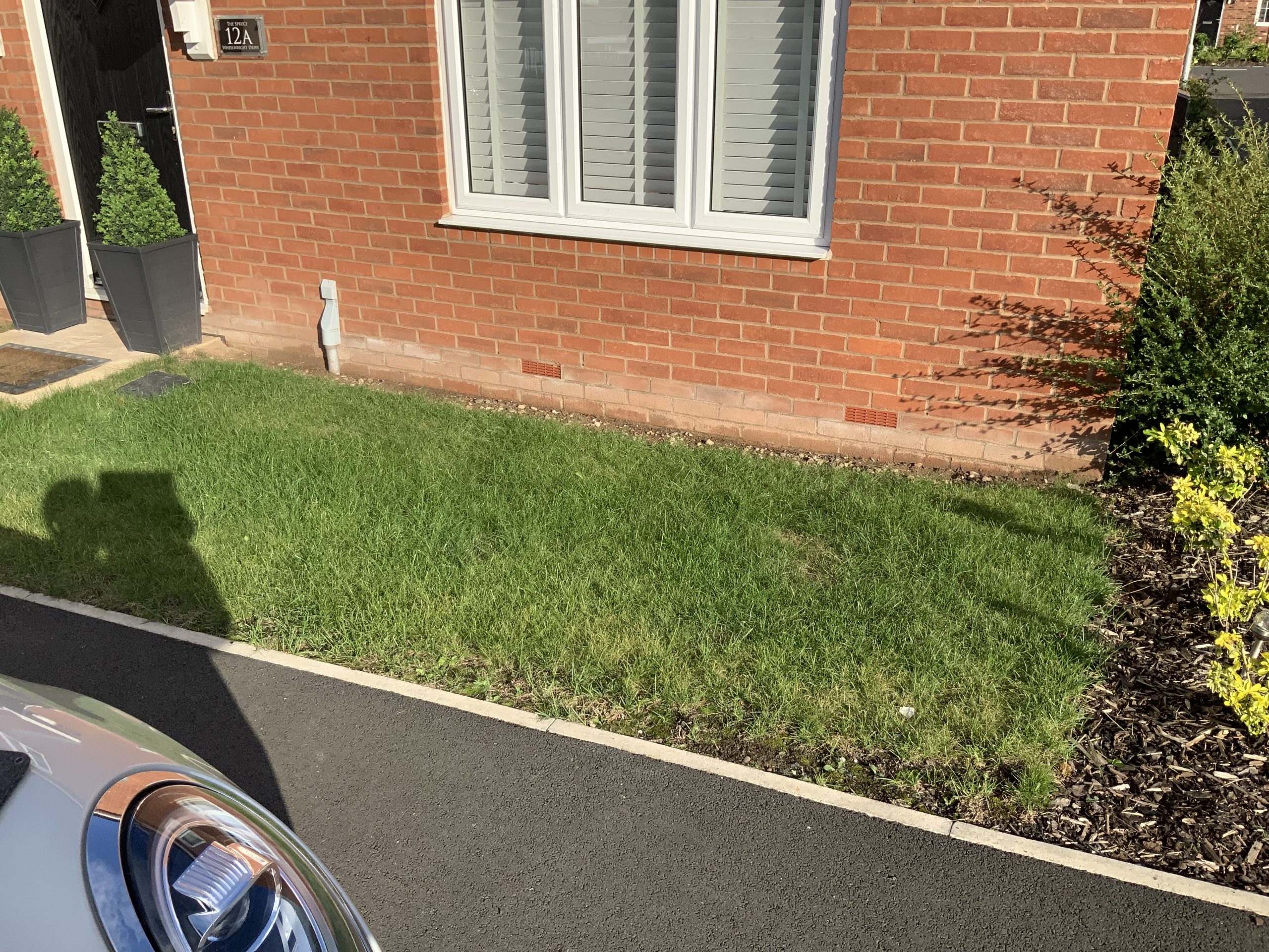 Area beside the front door step before the makeover, Stone