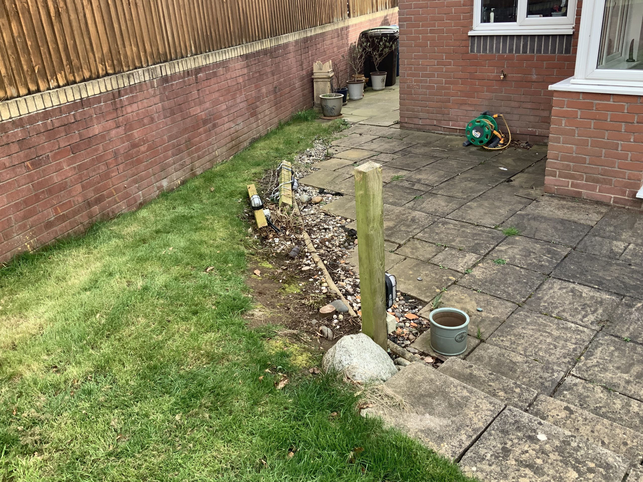 Garden before new patios and sleeper planters, Stone