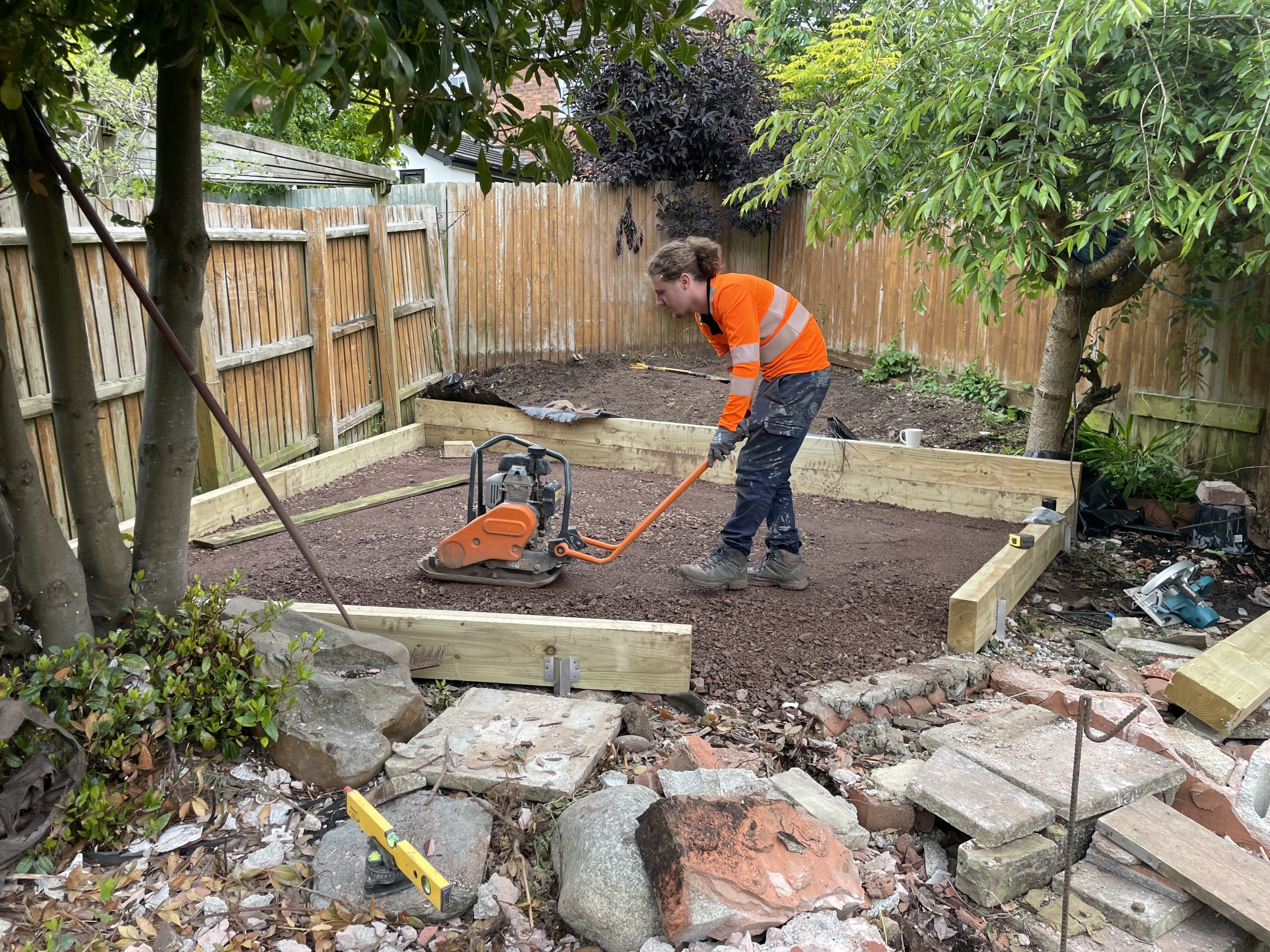 Patios and sleeper planters under construction, Stone