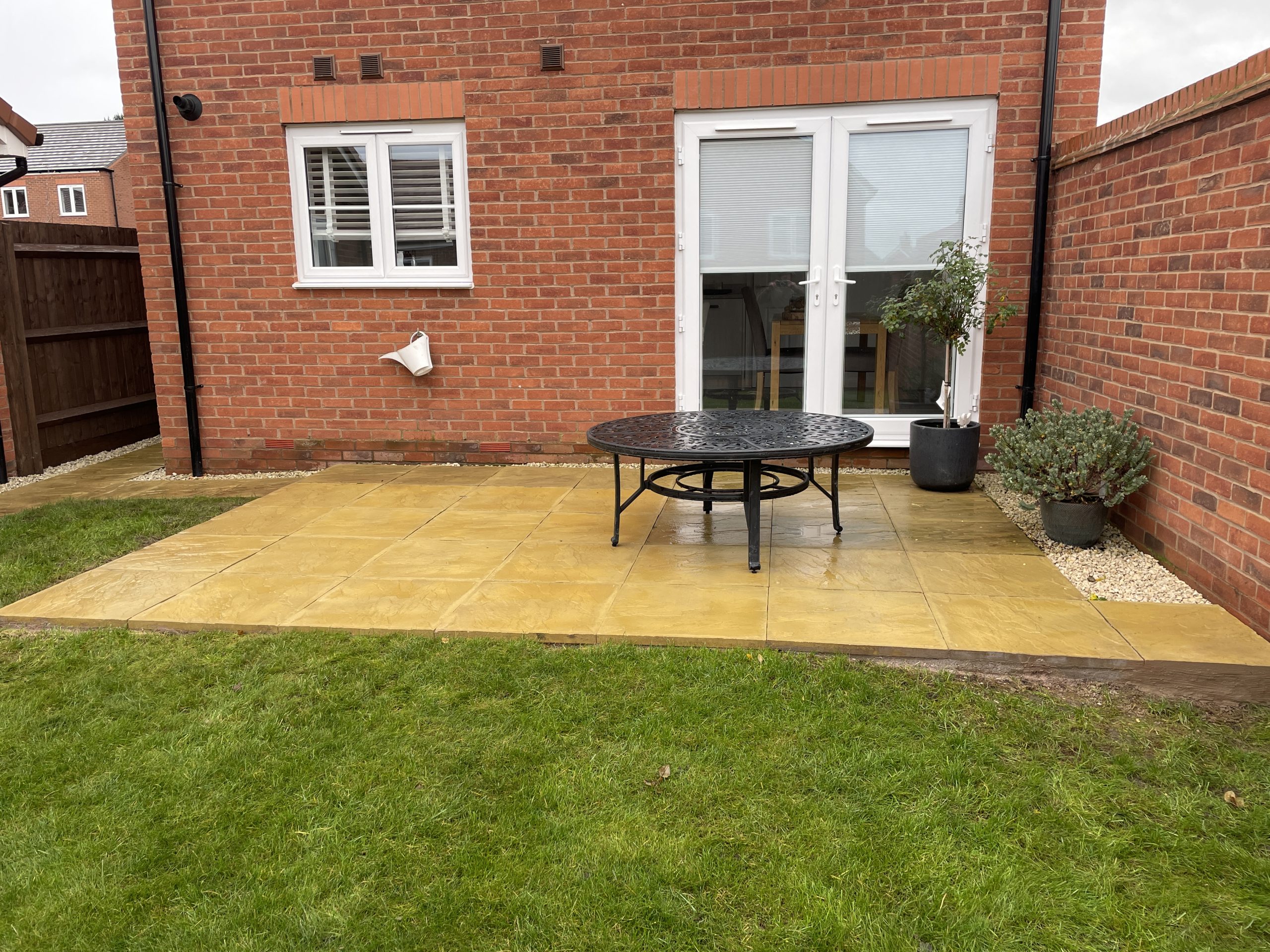 Riven patio extension blending seamlessly with the existing paving, Stone